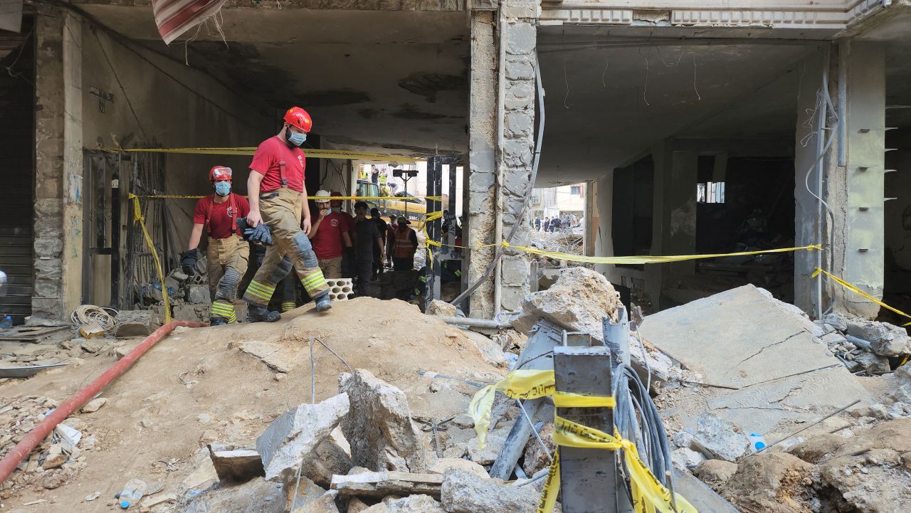 Municipality and civil defense workers inspect the damage in adjacent buildings in Beirut on Saturday, September 21.