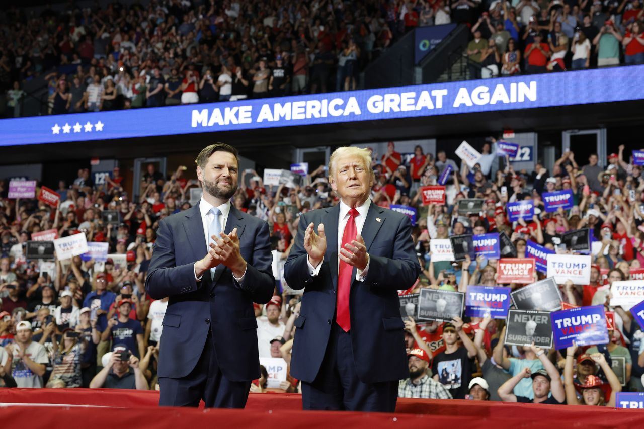 Sen. JD Vance and former President Donald Trump stand onstage during a campaign rally in Grand Rapids, Michigan, on July 20.