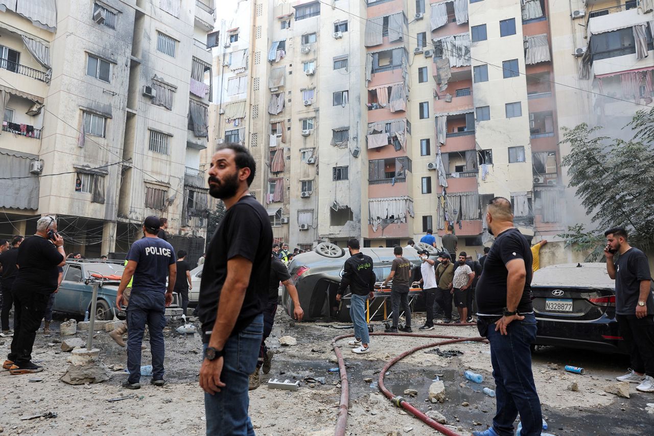 People inspect the site of an Israeli strike in the southern suburbs of Beirut, Lebanon, September 20.