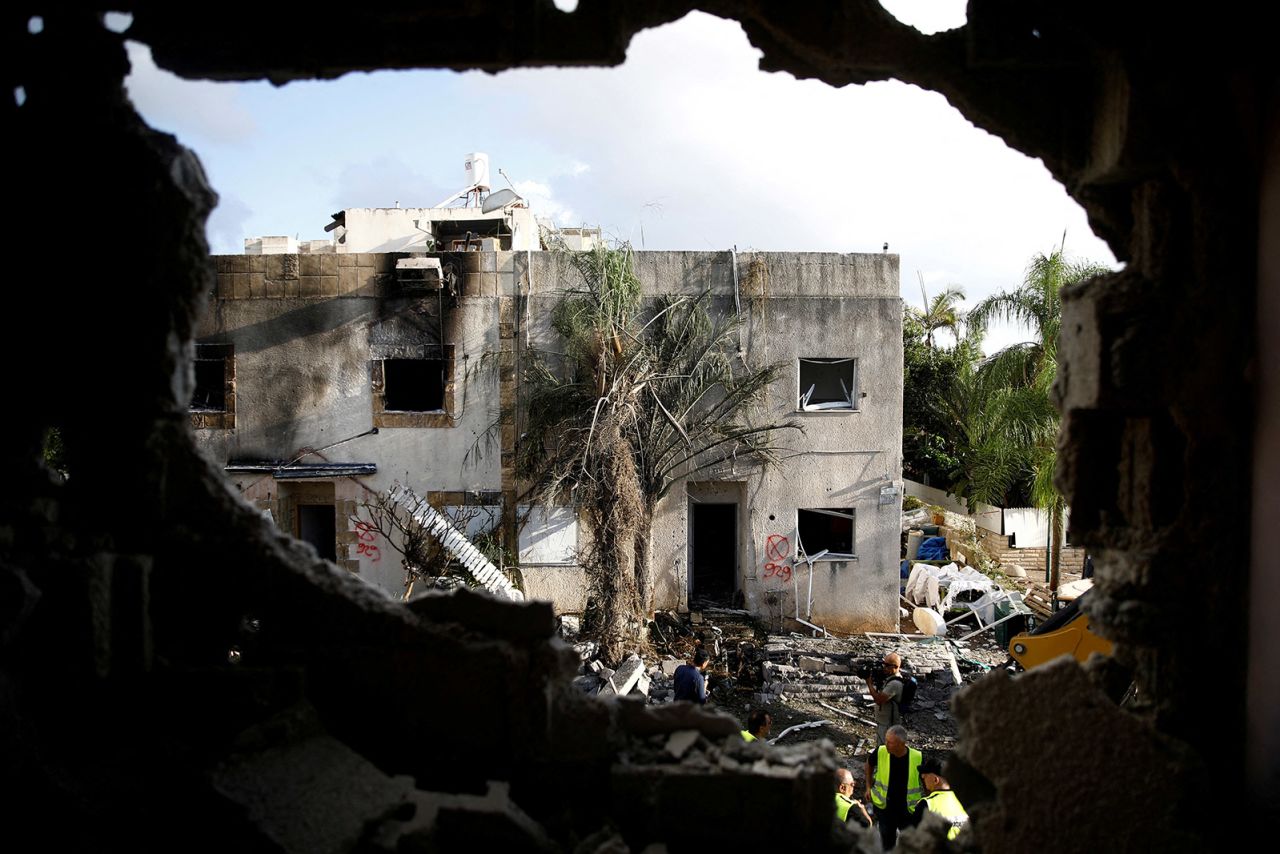 Emergency personnel work at a site of houses damaged following a rocket attack from Lebanon in Kiryat Bialik, Israel, on September 22.