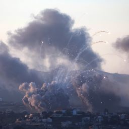 Smoke billows over southern Lebanon following Israeli strikes, as seen from Tyre, southern Lebanon on September 23, 2024.