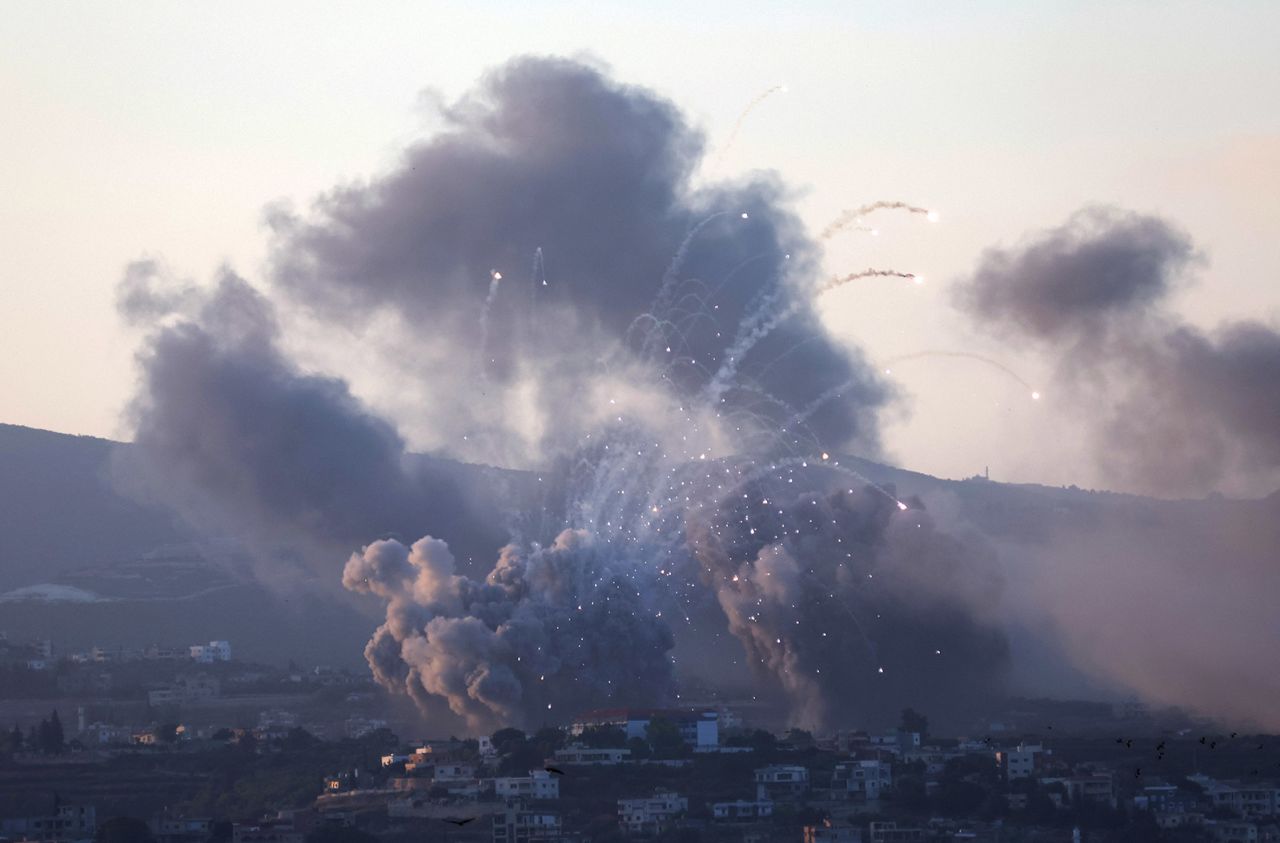 Smoke billows over southern Lebanon following Israeli strikes, as seen from Tyre, southern Lebanon on September 23. 