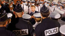 French President Emmanuel Macron talks to policemen during a visit to a police station of the northern neighbourhoods on the first day of his visit to Marseille on September 1, 2021. 