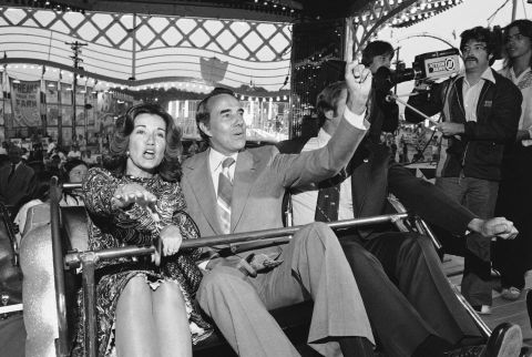 Dole and his wife, Elizabeth, enjoy a carnival ride at the Maryland State Fair in 1976.
