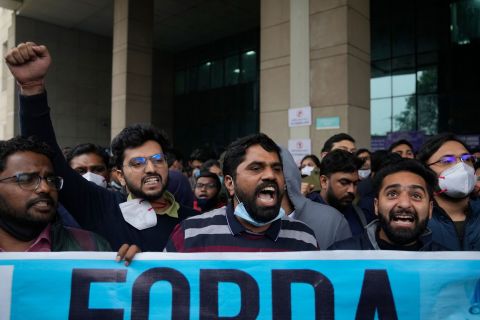 Junior doctors of a government medical college hospital shout anti-government slogans as they march in New Delhi on Tuesday.