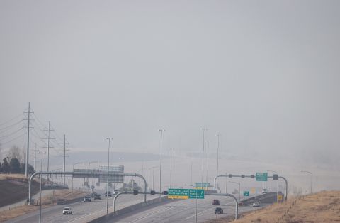Smoke and haze fills the sky due to fast moving wildfires in the area on December 30, in Broomfield, Colorado. 