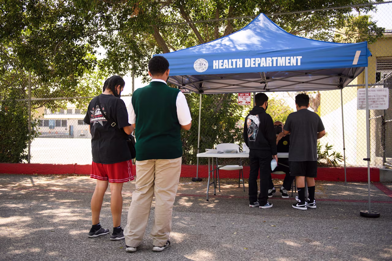 Teens receive their vaccination cards after being vaccinated in Los Angeles in May 2021.