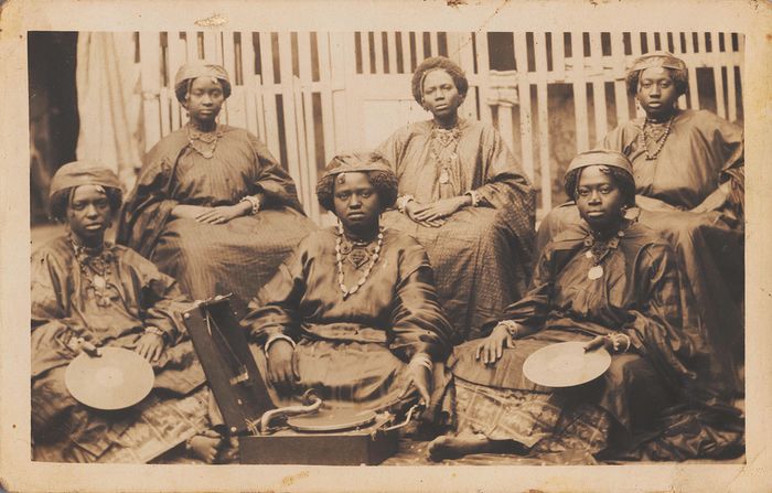 New book “Portrait and Place: Photography in Senegal, 1840-1960” shines a light on early photography in West Africa. Author Giulia Paoletti makes the case that Senegal was at the forefront of the new technology, starting with the backstories of photographs taken just a few years after its commercial invention. (Pictured: “Group portrait with record player,” by an unidentified artist, c.1920s–1930s.) <strong><em>Scroll through the gallery to learn more.</em></strong>