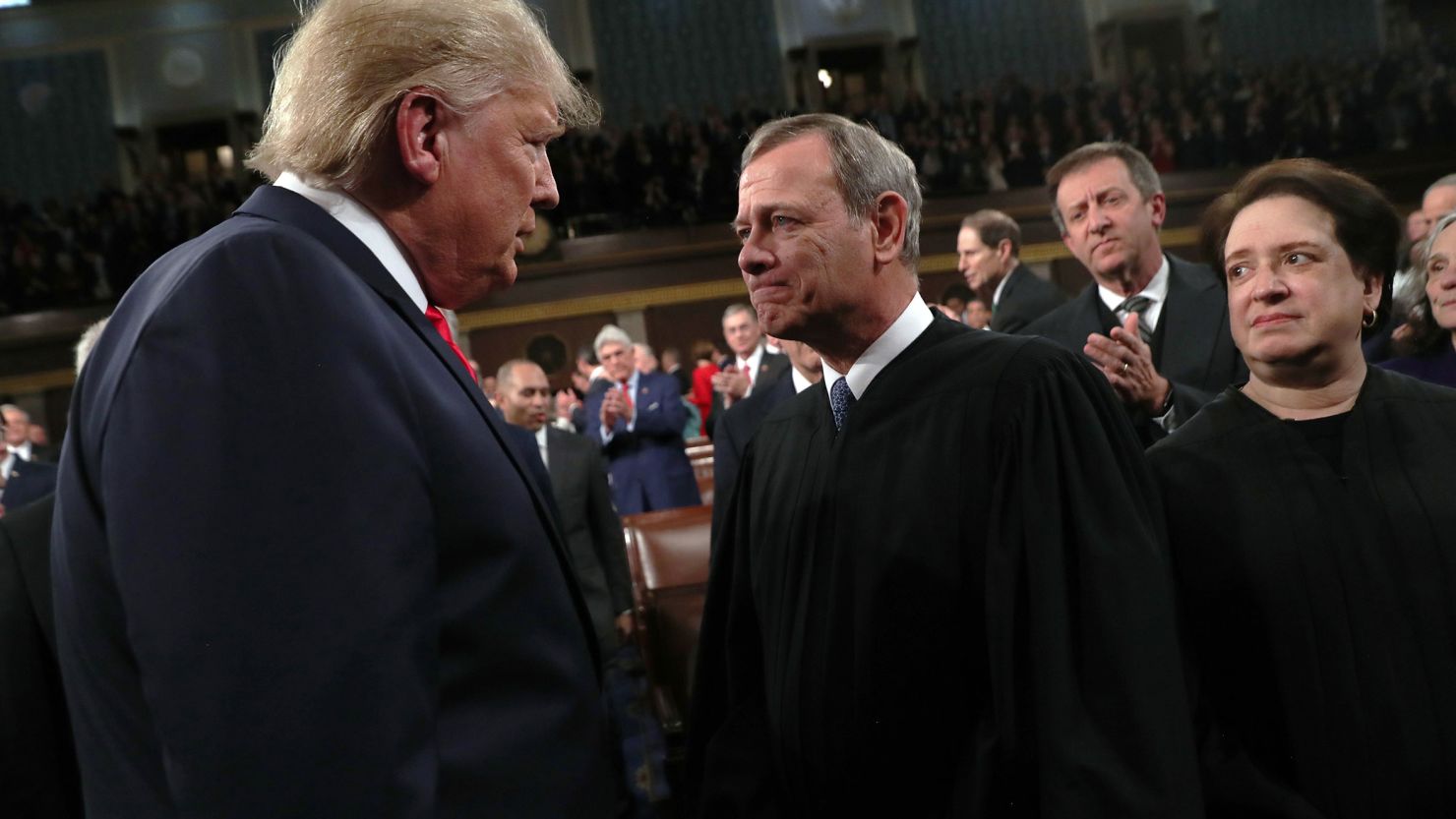 President Donald Trump talks with Supreme Court Chief Justice John Roberts as Associate Justice Elena Kagan looks on before the State of the Union address on February 4, 2020, in Washington, DC.