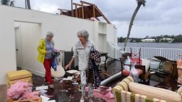 Bayou West resident Mary Singer, 82, and friend Brita Gwynn, 84, try to salvage items from Singer's second floor home after an apparent tornado touched down on the central beach community, leaving a path of destruction after Hurricane Milton in Vero Beach, Florida, U.S. October 11, 2024.  Kaila Jones/USA Today Network via REUTERS. 
NO RESALES. NO ARCHIVES