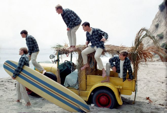 The Beach Boys pose for a portrait with a vintage station wagon in Los Angeles in 1962. From left are Dennis Wilson, Carl Wilson, Mike Love, Brian Wilson and David Marks. Carl, Dennis and Brian were brothers.