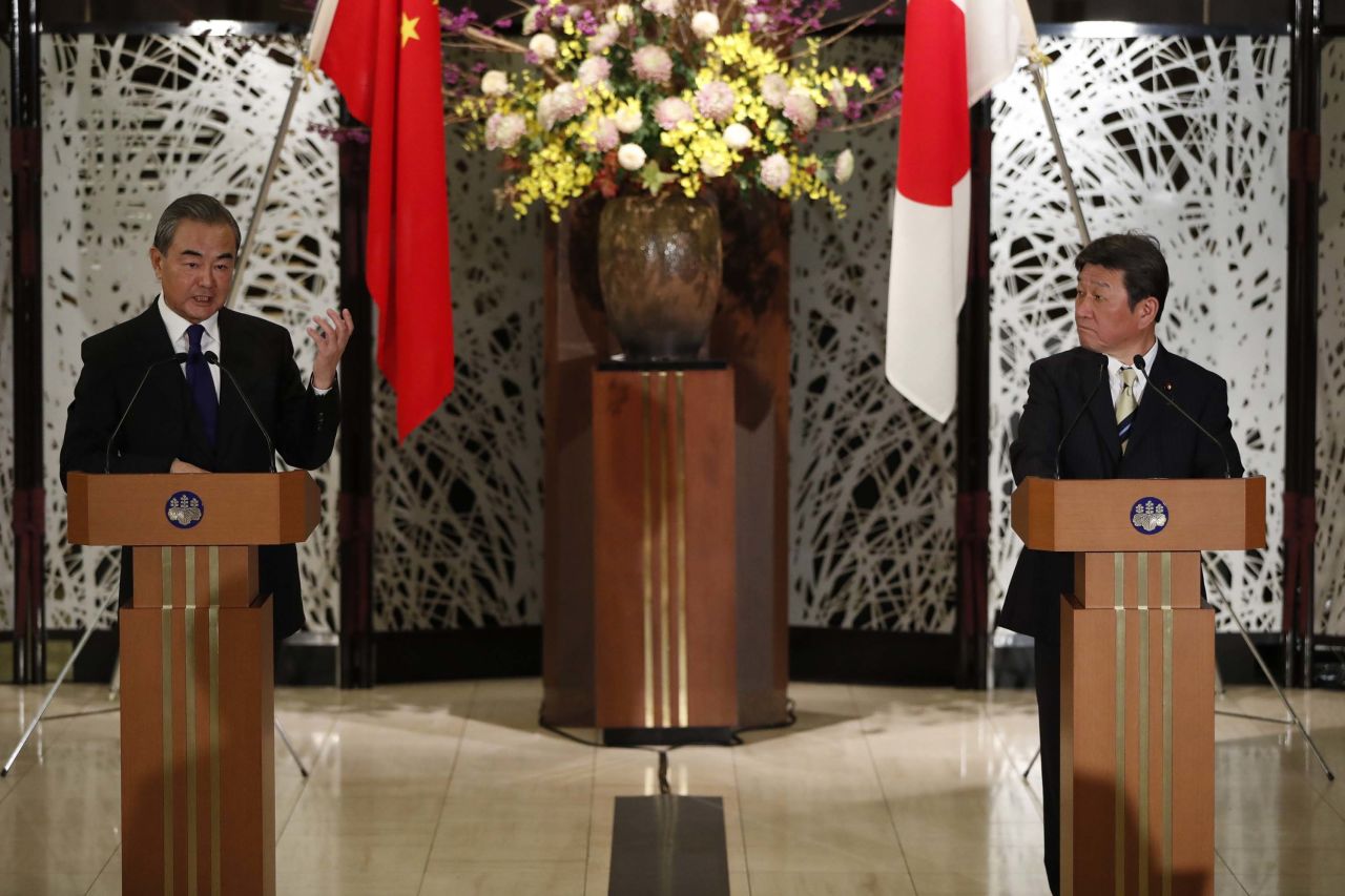 China's State Councillor and Foreign Minister Wang Yi, left, holds a joint press conference with his Japanese counterpart Toshimitsu Motegi after their meeting in Tokyo, Japan, on November 24.