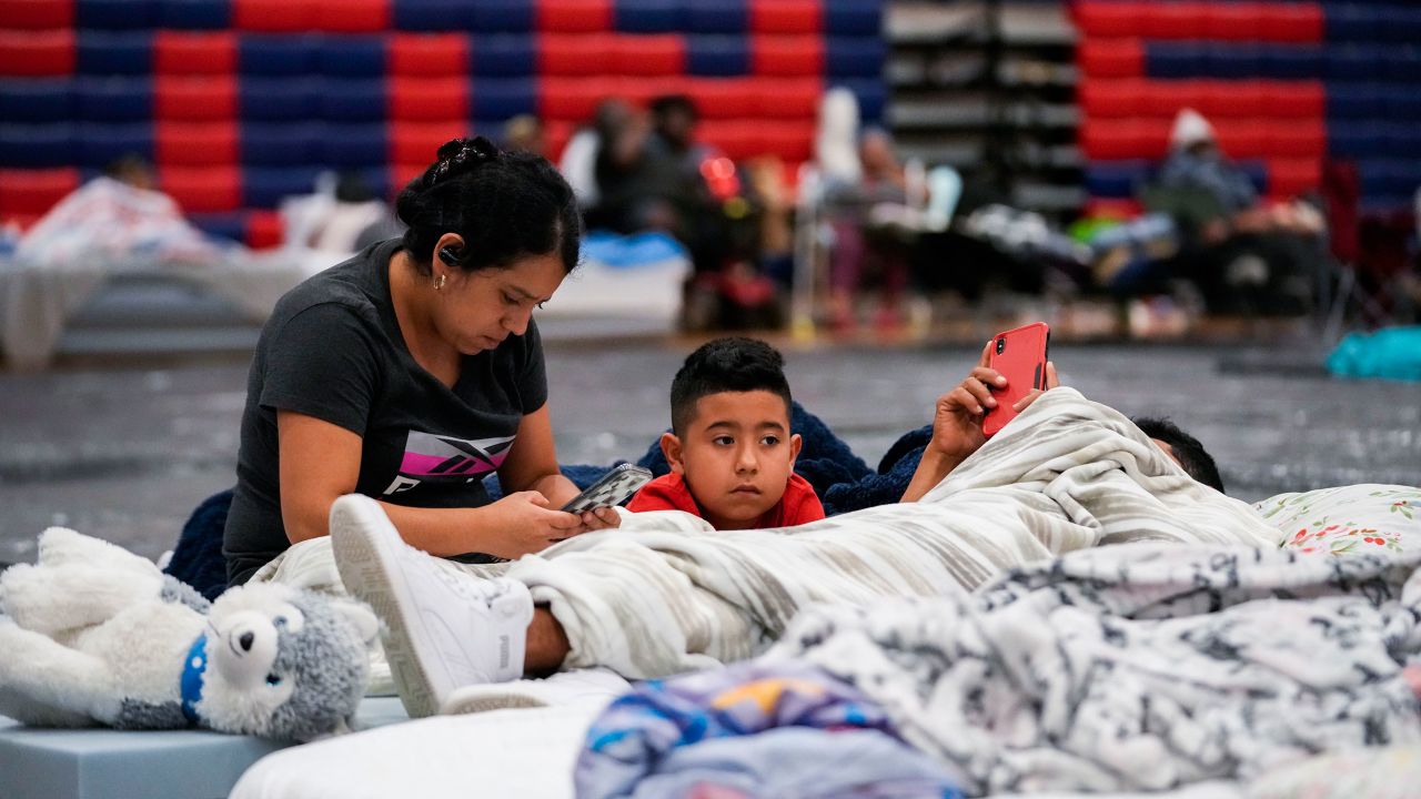 Cynthia Centeno, a Tallahassee resident, sits with her family inside a hurricane evacuation shelter at Fairview Middle School in Leon County, Florida, on Thursday.