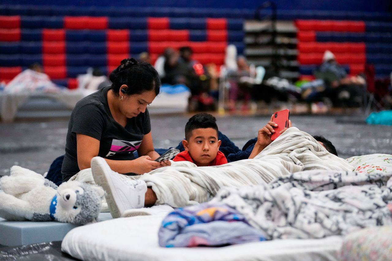 Cynthia Centeno, a Tallahassee resident, sits with her family inside a hurricane evacuation shelter at Fairview Middle School in Leon County, Florida, on Thursday.