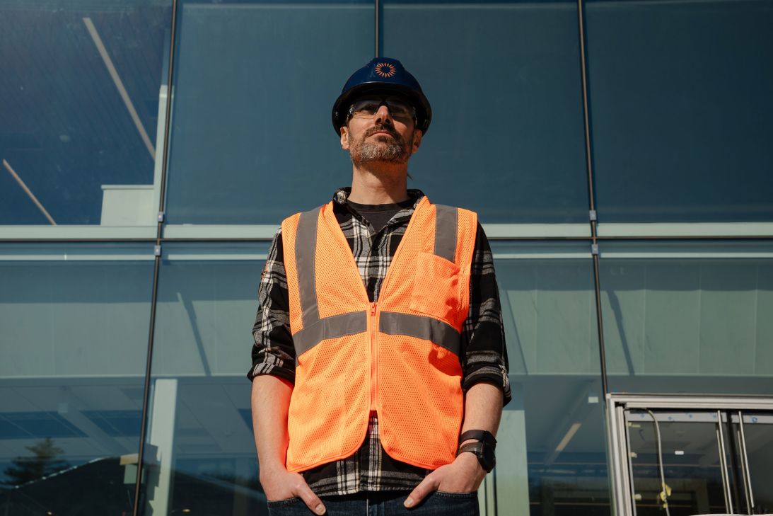 Commonwealth Fusion Systems co-founder and chief science officer, Brandon Sorbom, poses for a portrait in front of the company's facility in Devens, Massachusetts.