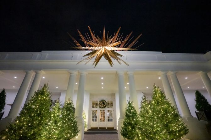 Guests enter the East Wing of the White House under a rotating starlight.