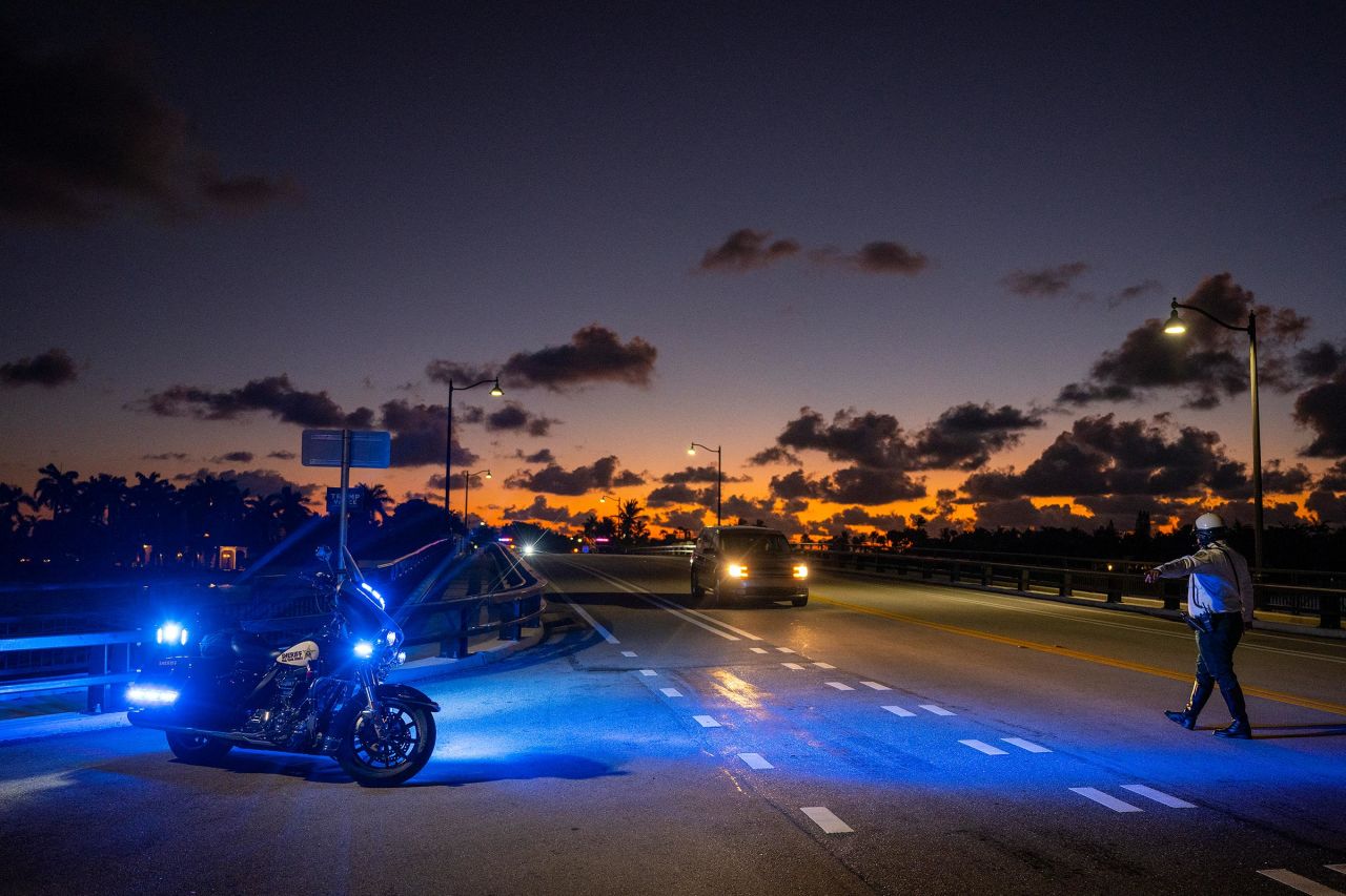 Police close a road before the motorcade of US President-elect Donald Trump departs Mar-a-Lago in Palm Beach, Florida, on November 13.