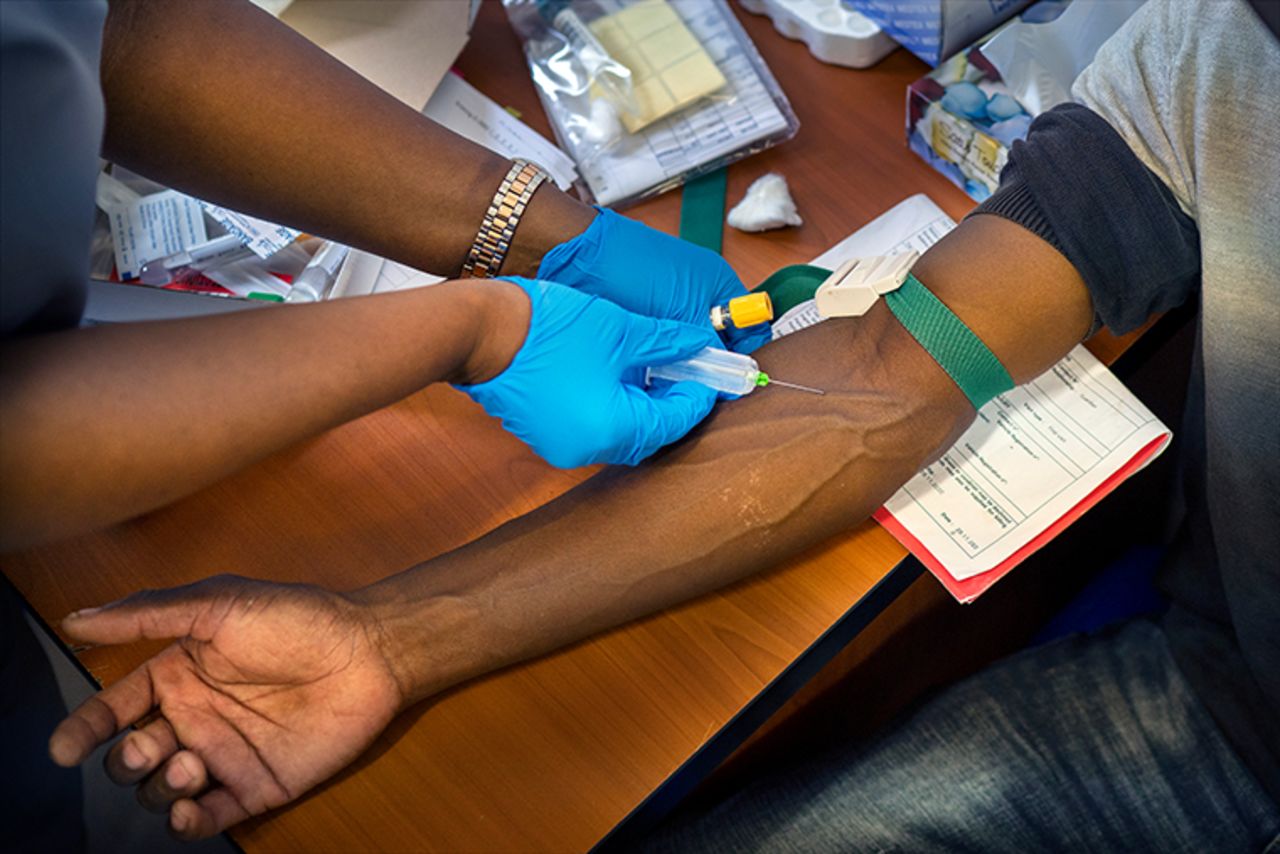 Blood is drawn from a clinical trials patient for the AstraZeneca test vaccine at the University of Witwatersrand' Soweto's Chris Sani Baragwanath Hospital facility outside Johannesburg on Nov. 30, 2020.