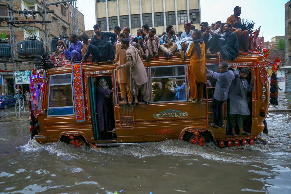 A bus carries people through floodwaters in Hyderabad, Pakistan, on July 14.