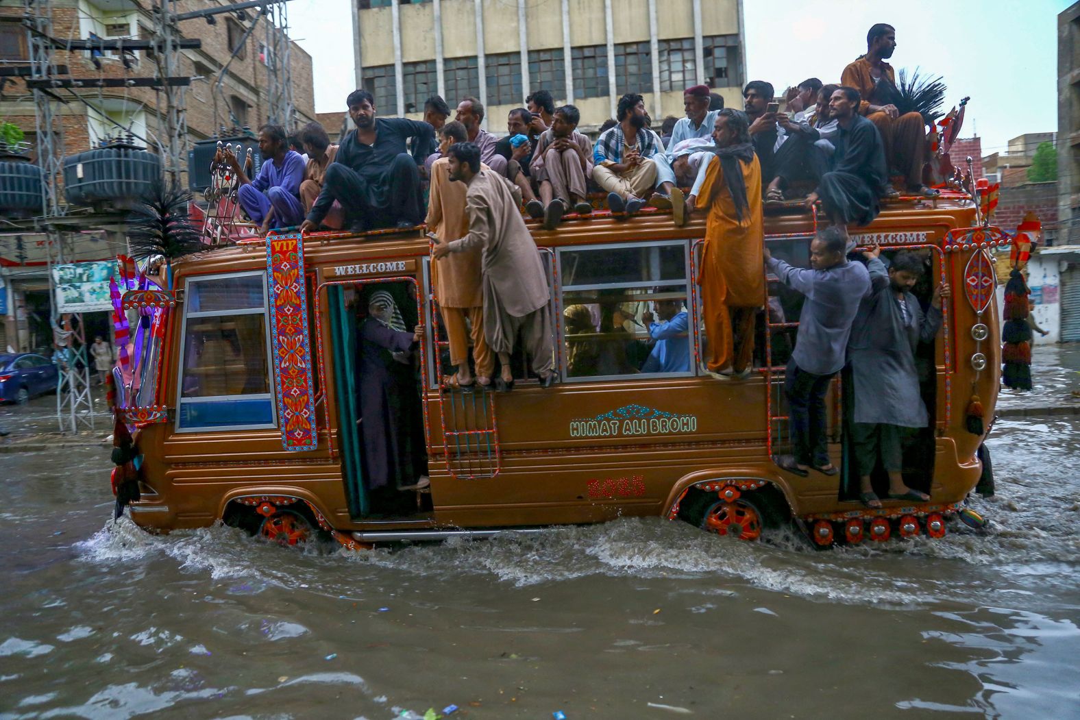 A bus carries people through floodwaters in Hyderabad, Pakistan, on July 14.
