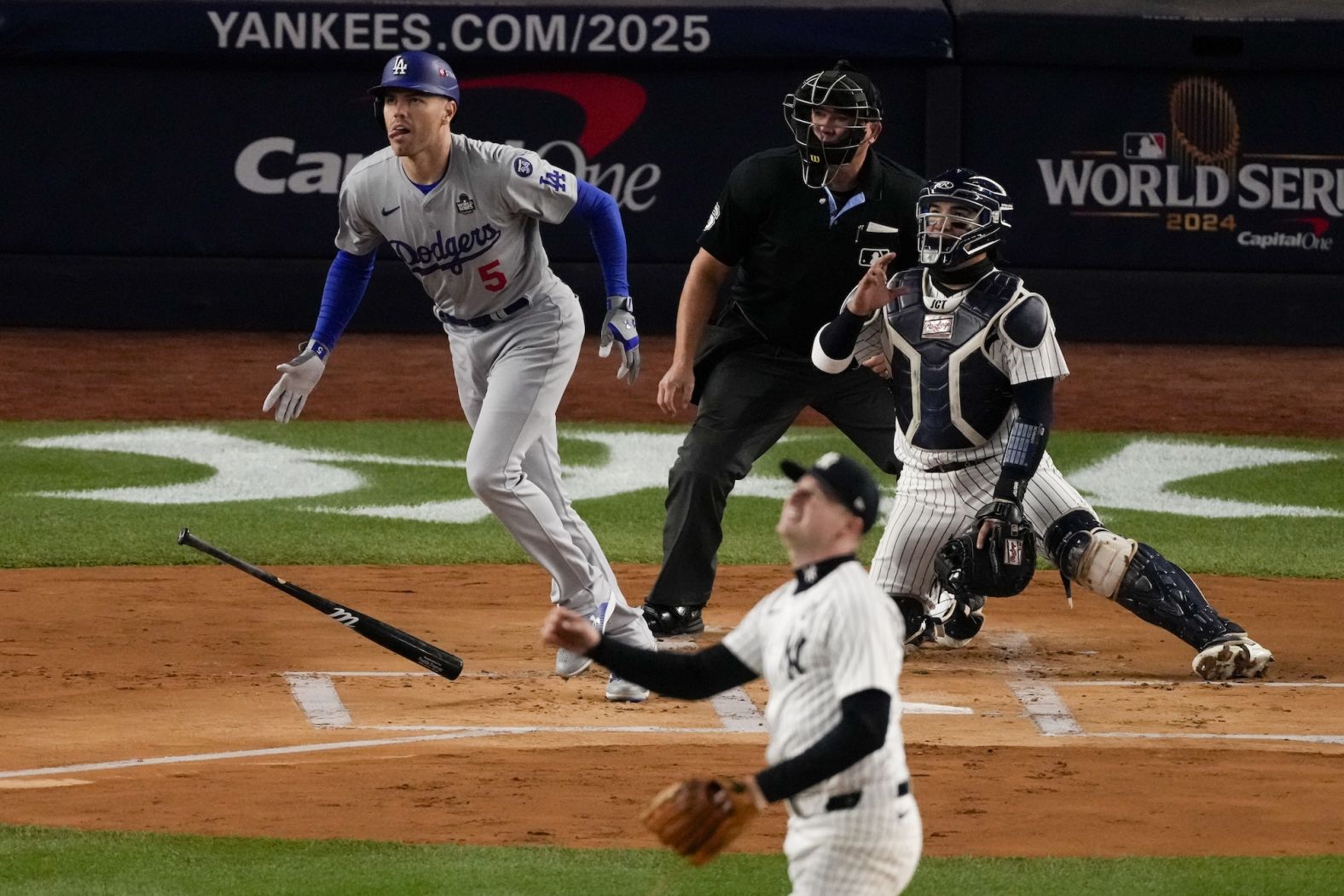 Freeman watches his home run in the first inning of Game 3.