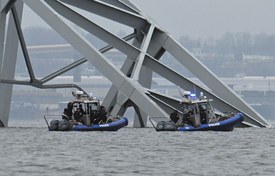 Police recovery crews work near the collapsed Francis Scott Key Bridge in Baltimore on Tuesday.