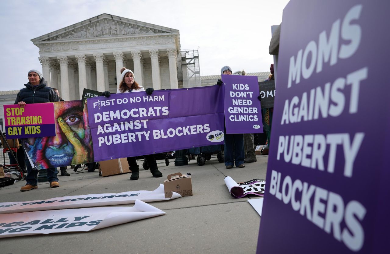 Transgender rights opponents rally outside of the U.S. Supreme Court as the justices hear arguments in a case on transgender health rights on December 04, 2024 in Washington, DC. 