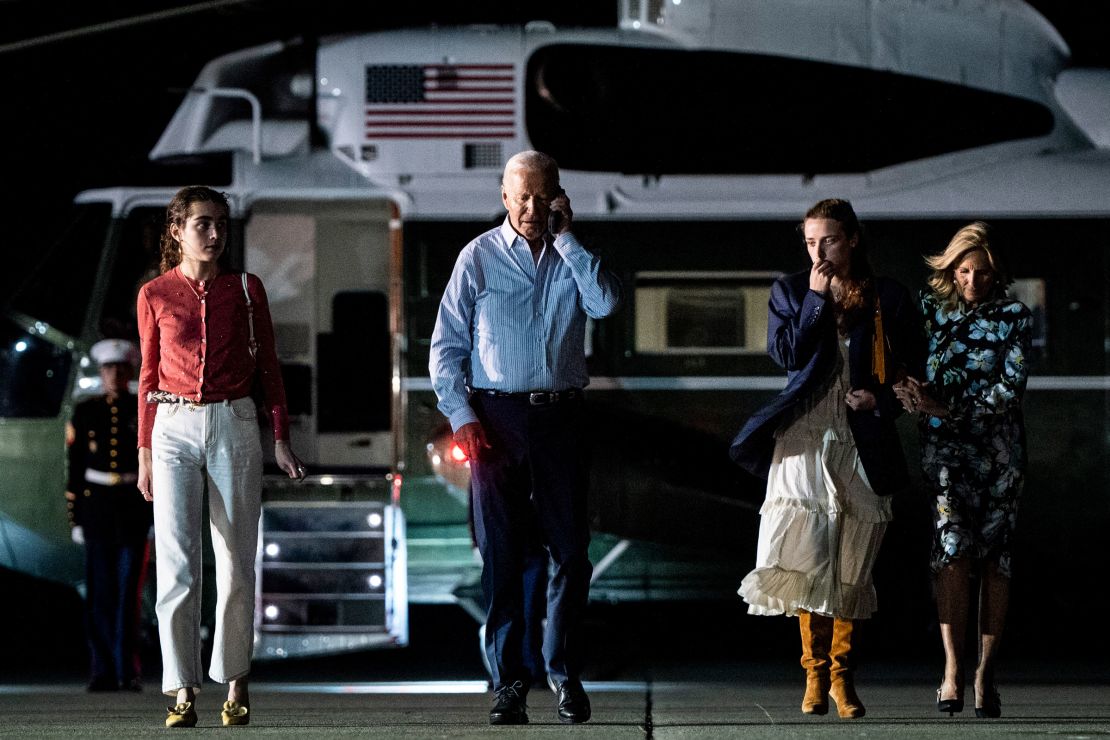 President Joe Biden talks on the phone as he and first lady Jill Biden, with their granddaughters Finnegan and Natalie Biden, depart Burlington County, New Jersey, en route to Maryland, after campaign receptions in New York and New Jersey, on Saturday, June 29, 2024.