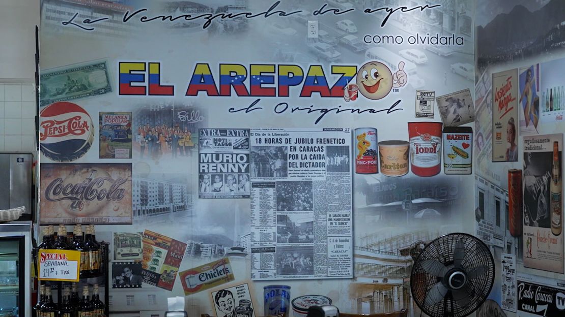 The interior of El Arepazo is decorated with images of Venezuelan products and prints of old newspaper front pages from the country.