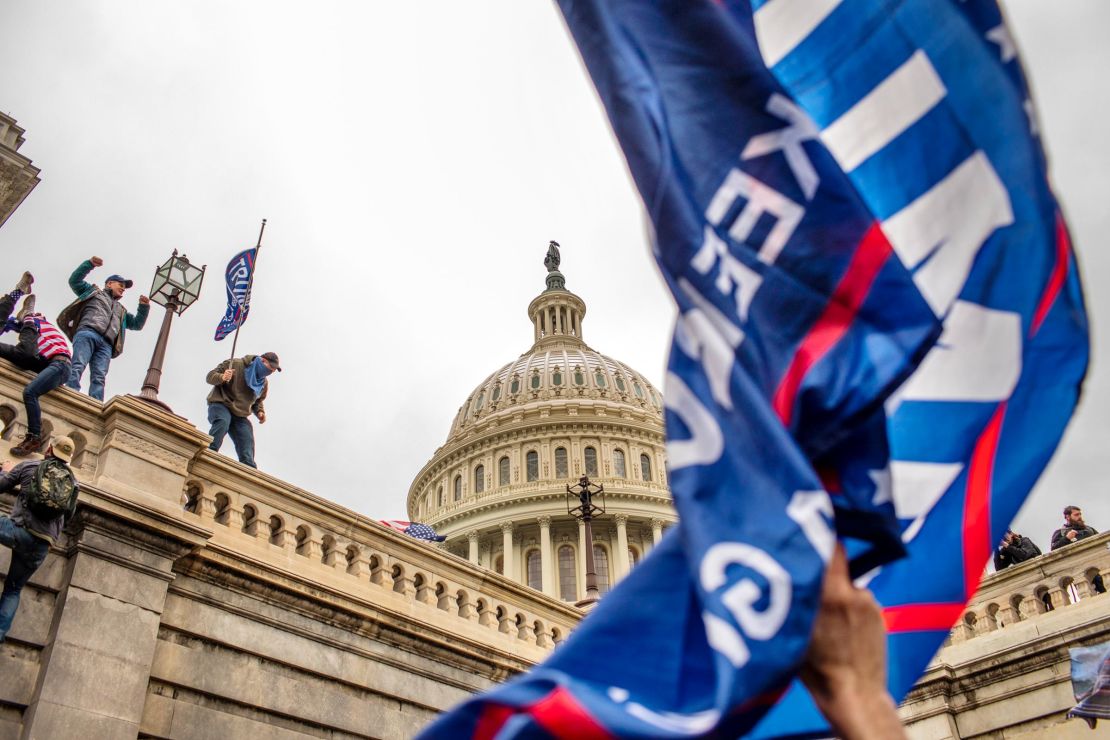 Supporters of Donald Trump riot outside the US Capitol in Washington, DC, on January 6, 2021.
