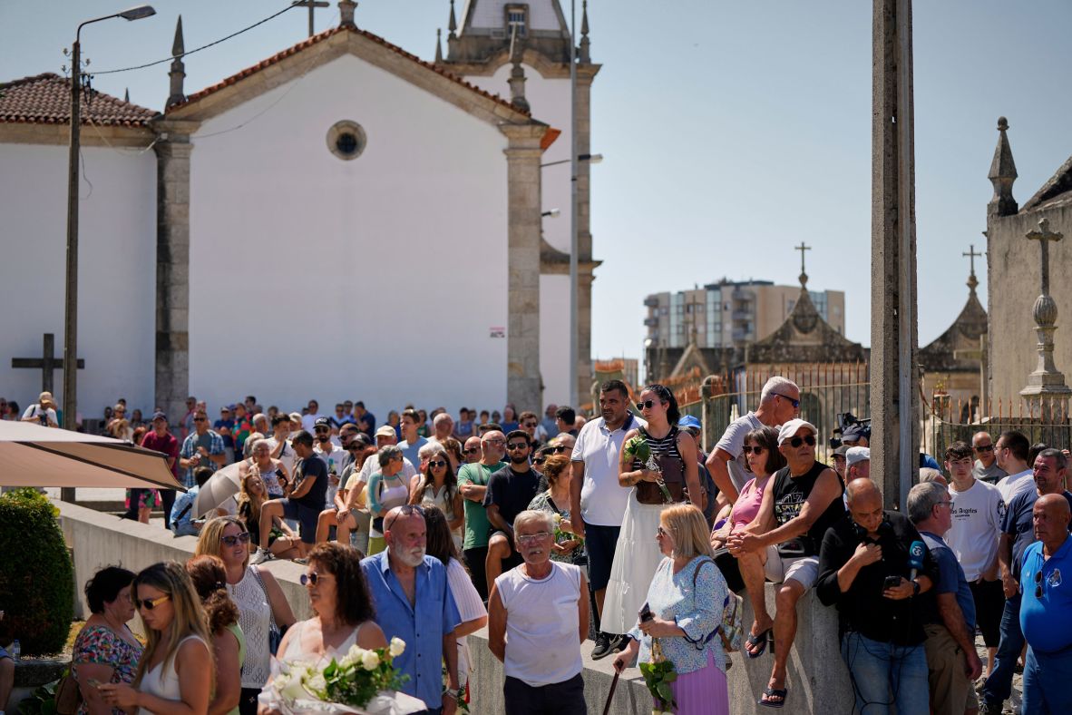 People gather at the church in Gondomar on Friday.
