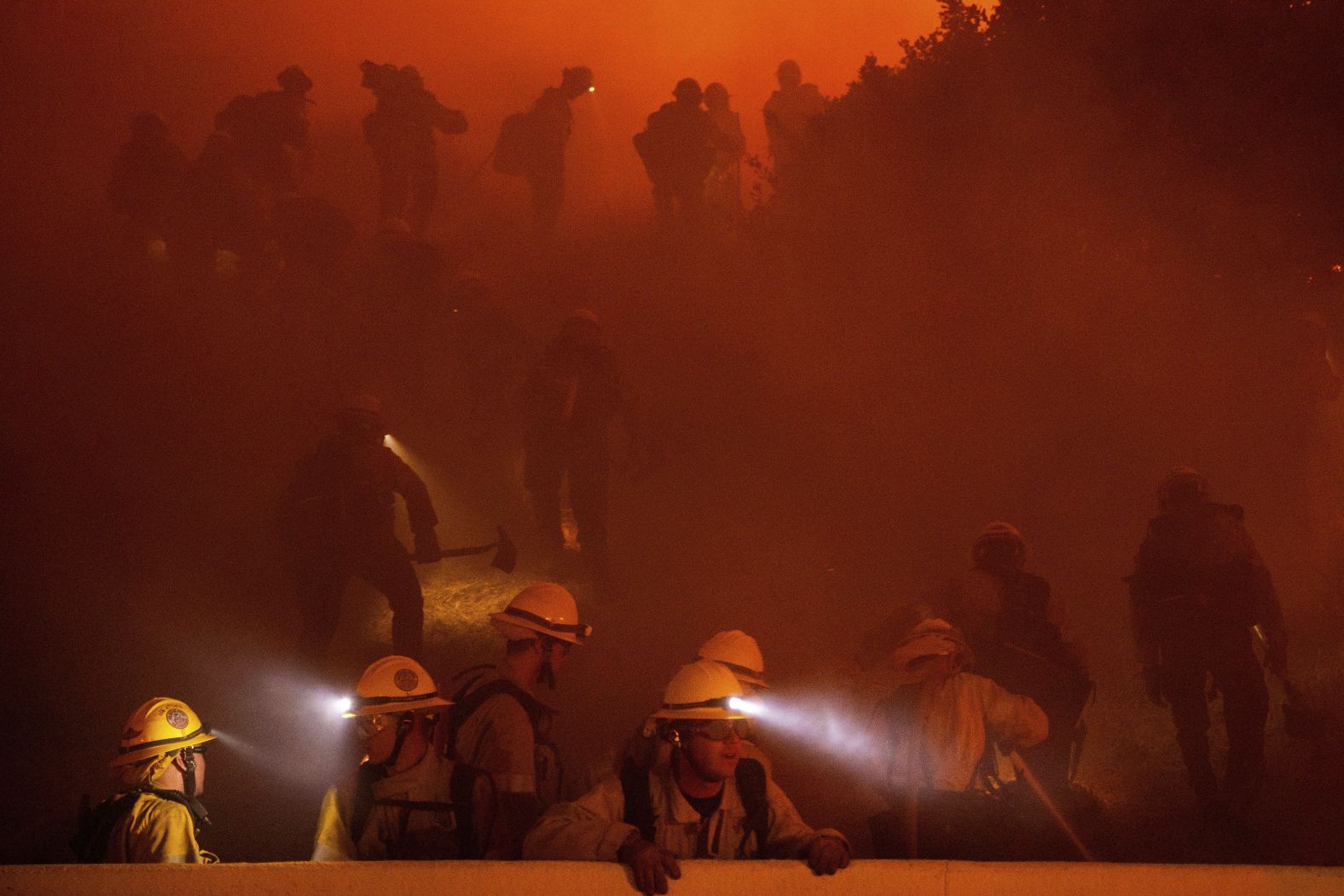 Firefighters work together on Tuesday.