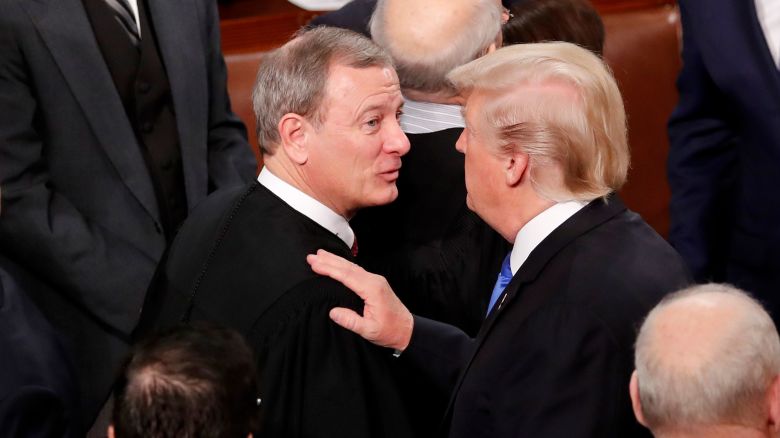 President Donald Trump talks with Supreme Court Chief Justice John Roberts as he departs after delivering his State of the Union address to a joint session of the Congress on Capitol Hill in Washington, DC, in January 2018.