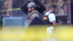 Louisiana law enforcement work the scene on Iberville Street as they pursue a fugitive that escaped from a New Orleans jail, Tuesday, May 20, 2025, in New Orleans. (AP Photo/Gerald Herbert)