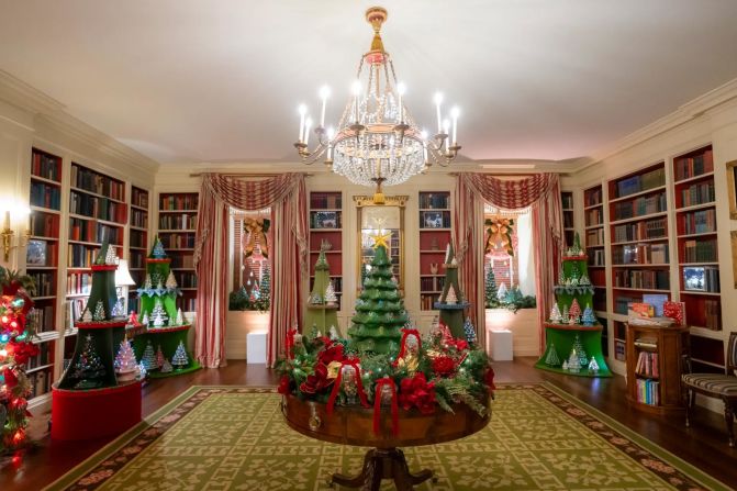 Vintage ceramic Christmas trees are featured throughout the library. President Franklin D. Roosevelt chose this room to serve as the White House Library in 1935.