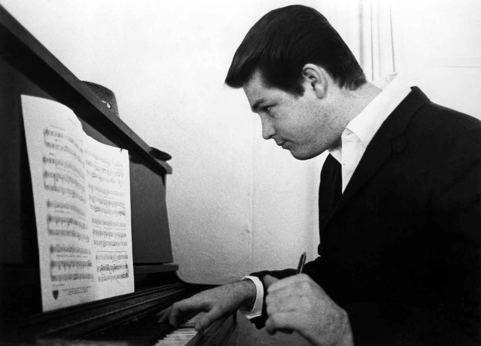 Brian Wilson works on a composition in 1964. Despite a childhood scarred by his father’s abuse, becoming partially deaf, and the years of haunting voices in his head from schizoaffective disorder, Wilson went on to become the “reigning king of pop melody,” as the <a href="index.php?page=&url=https%3A%2F%2Fwww.denverpost.com%2F2015%2F07%2F01%2Fbrian-wilson-says-hes-not-americas-mozart-bach-maybe%2F" target="_blank">Denver Post</a> once put it. He would often bring to life songs that told a much different tale than his own reality. “That is probably why I wrote those happy songs. I try to get as close to paradise as I can,” Wilson told <a href="index.php?page=&url=https%3A%2F%2Fwww.nytimes.com%2F2004%2F07%2F04%2Fmagazine%2Fthe-way-we-live-now-7-4-04-questions-for-brian-wilson-summer-fun-anyone.html" target="_blank">The New York Times Magazine</a> in 2004.