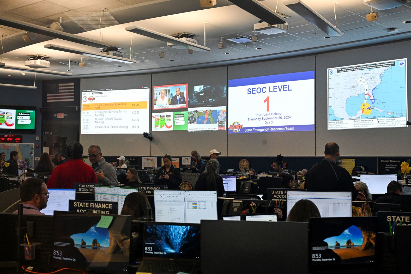 People work at the State Emergency Operations Center in Tallahassee, Florida, on Thursday.