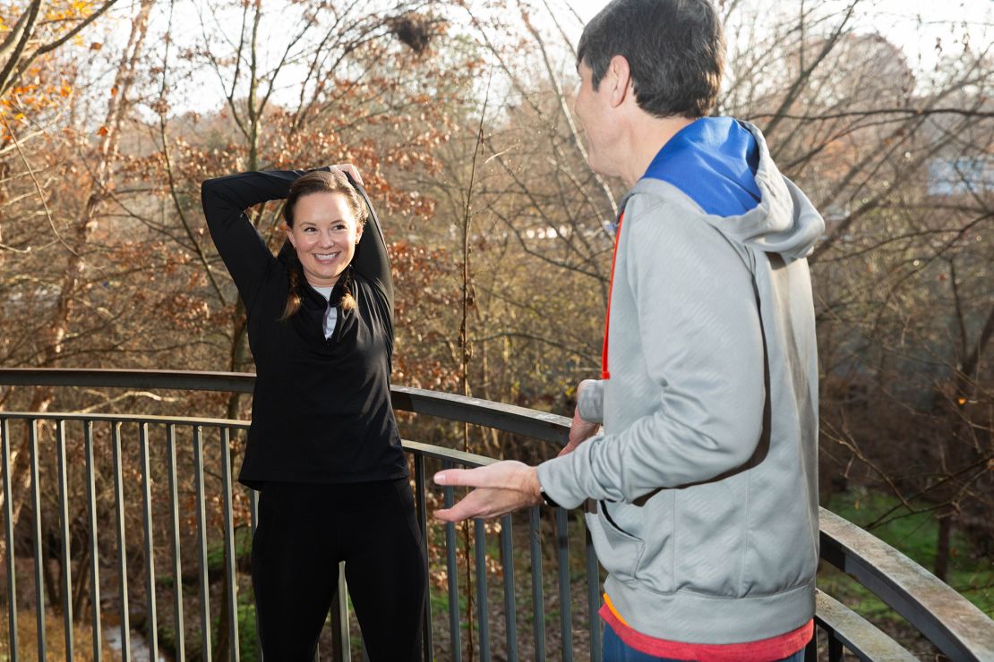 Madeline stretches while David explains that when it comes to warming up he's not a great role model.