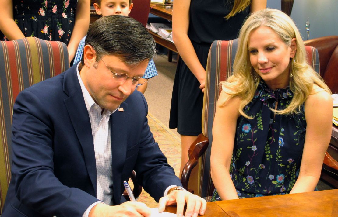 In this 2018 photo, US Rep. Mike Johnson files his paperwork at the secretary of state's office as he qualified for his congressional re-election bid in Baton Rouge, Louisiana.
