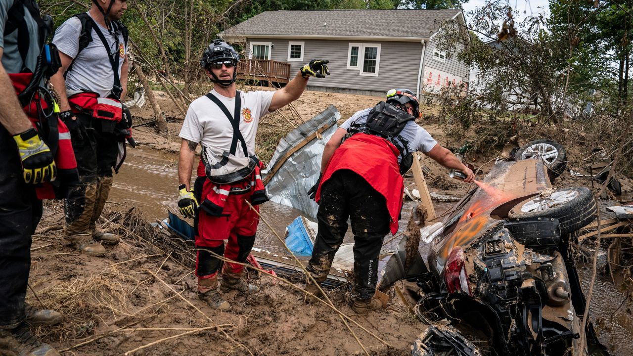 Members of the Illinois Water Rescue One team search through debris for survivors in the aftermath of Hurricane Helene in Swannanoa, North Carolina, on October 1.