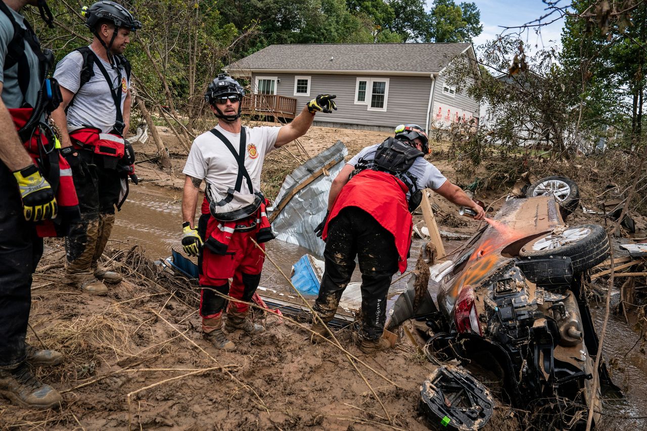 Members of the Illinois Water Rescue One team search through debris for survivors in the aftermath of Hurricane Helene in Swannanoa, North Carolina, on October 1.