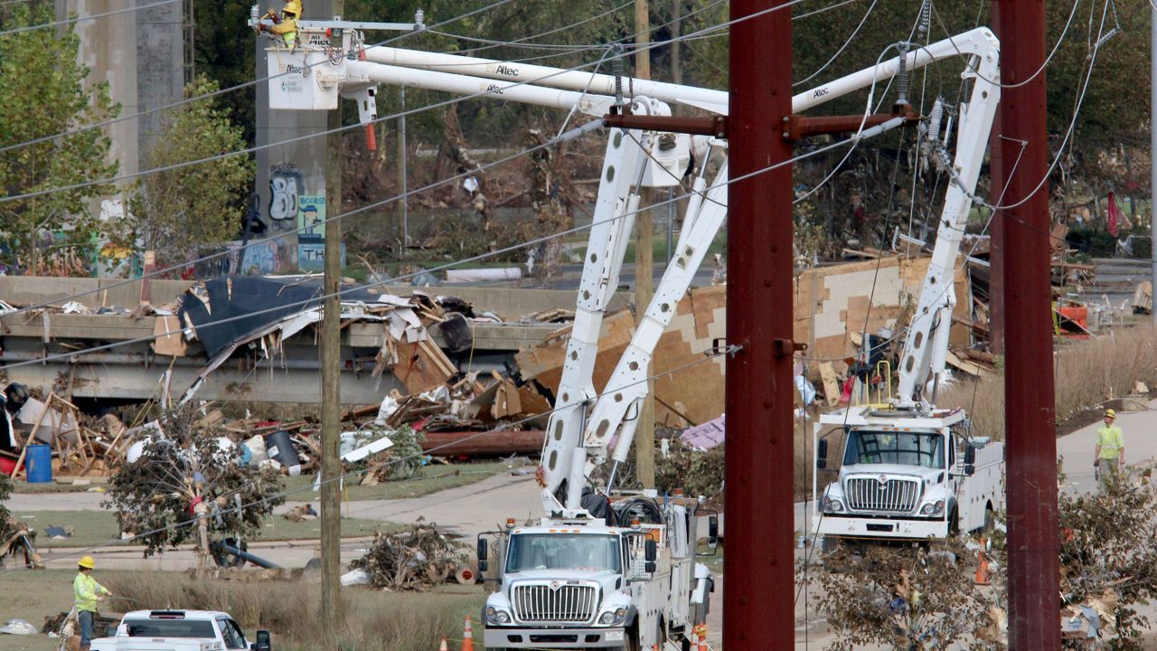 Power crews work along Riverside Drive in the destroyed River Arts District in Asheville, North Carolina, on October 1.