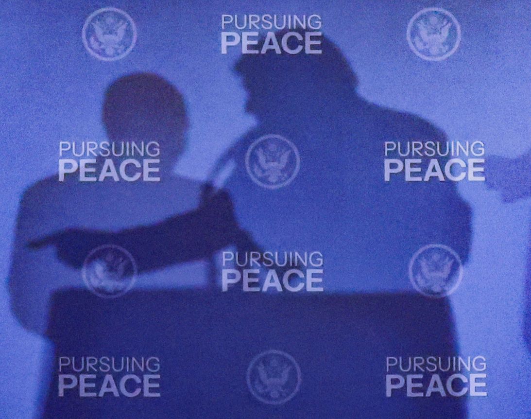 The shadows of US President Donald Trump and Russian President Vladimir Putin are cast during a press conference following their meeting.