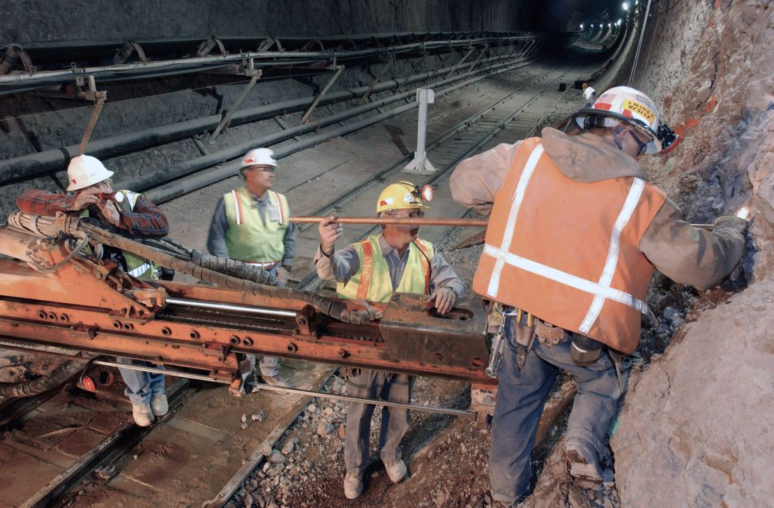 Men work in a tunnel at Yucca Mountain in 2003.