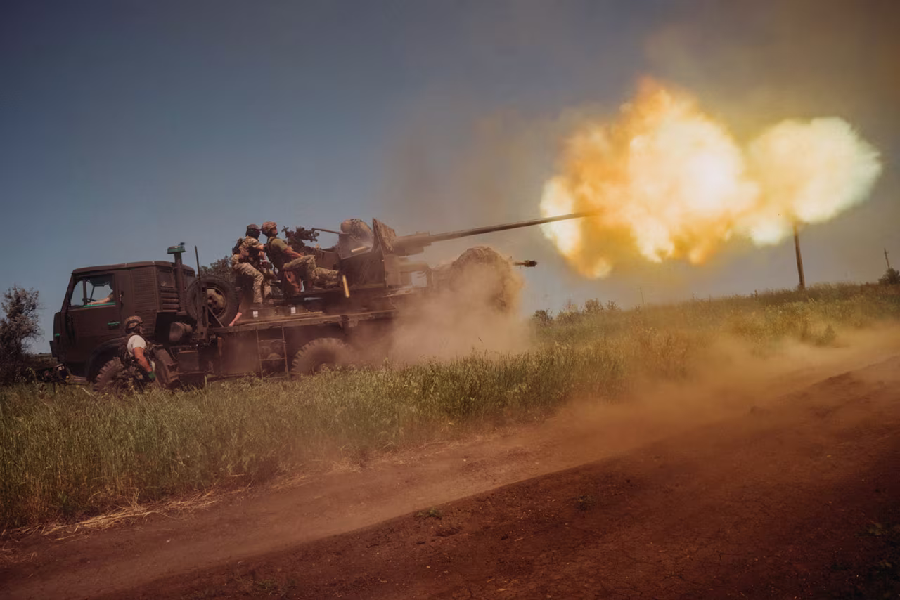 Ukrainian soldiers from the 60th Battalion of Territorial Defense shoot rounds into Russian positions with an S60 anti-aircraft canon placed on a truck, outside Bakhmut, Ukraine, on June 19. 