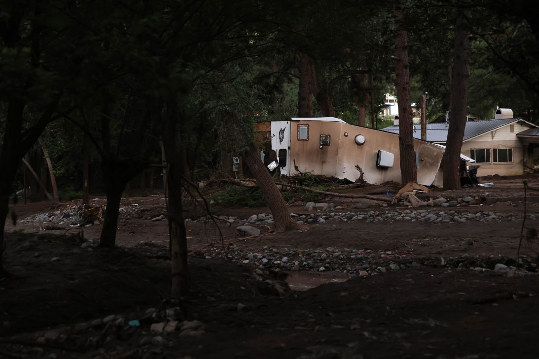 A flood-damaged trailer is seen near the Rio Ruidoso on August 27. According to locals, two children were swept from this trailer during flooding and died.