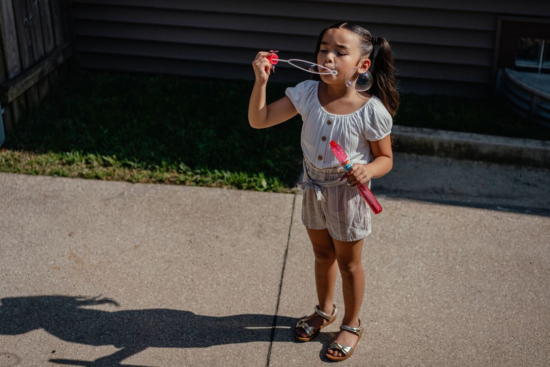 Yang's six-year-old daughter Baylee blows bubbles at her grandparents’ home.