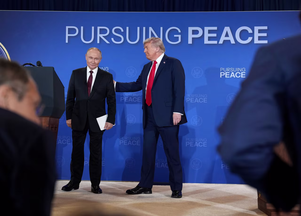 US President Donald Trump and Russian President Vladimir Putin leave at the conclusion of the news briefing.