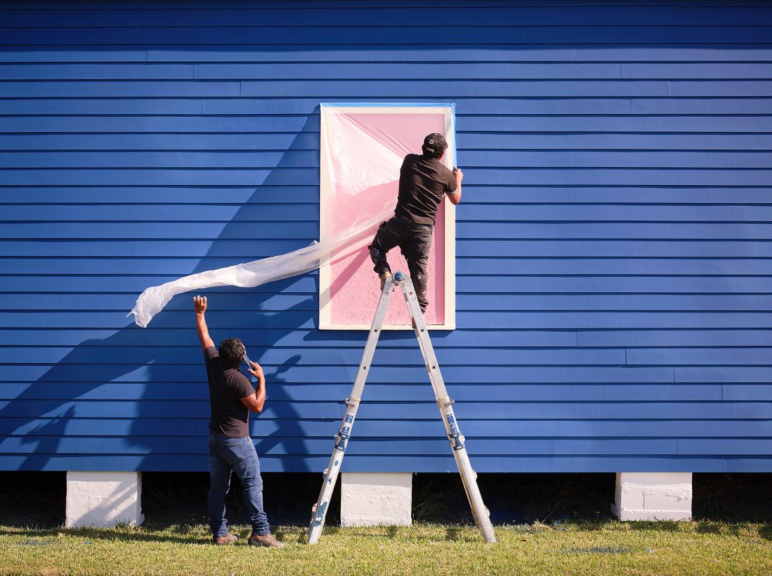 The buildings will remain blue through the end of the triennial, and possibly for longer.