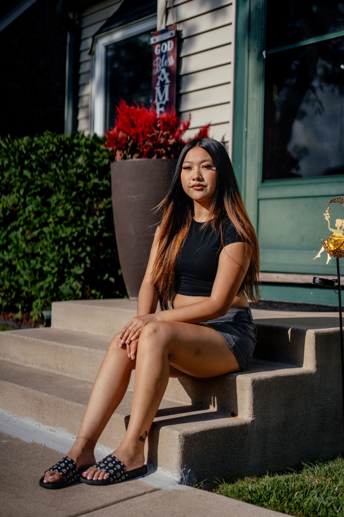 Yang's eldest daughter, Azia, sits for a portrait in West Milwaukee.